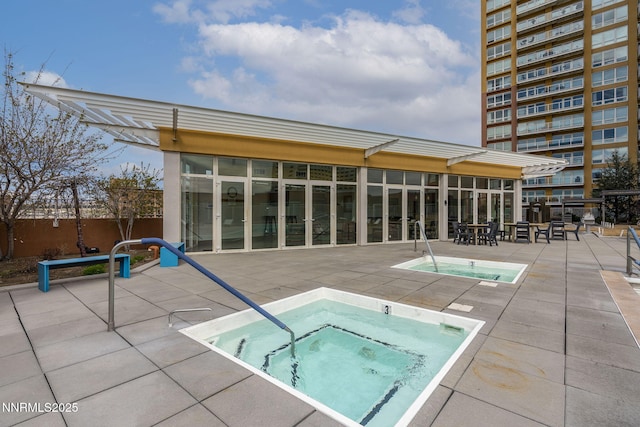 255 N Sierra St Unit 305, Reno, NV 89501 - view of pool with a hot tub, a pool, a patio, and a sunroom