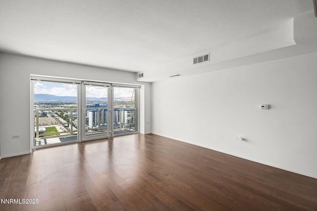255 N Sierra St Unit 2113, Reno, NV 89501 - empty room featuring dark wood-style flooring and baseboards