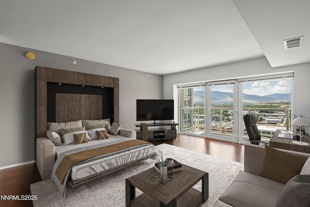 255 N Sierra St Unit 2113, Reno, NV 89501 - bedroom with access to outside and wood finished floors