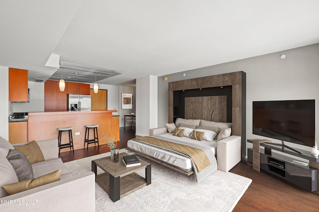 255 N Sierra St Unit 2113, Reno, NV 89501 - bedroom with stainless steel fridge and dark wood-type flooring