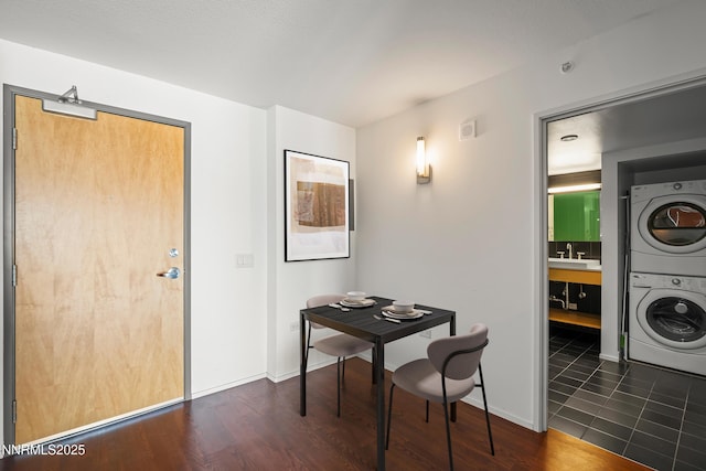 255 N Sierra St Unit 2113, Reno, NV 89501 - dining room with estacked washer and dryer and dark wood-style flooring