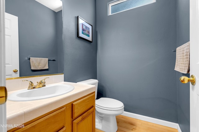 799 Caughlin Gln, Reno, NV 89519 - half bath featuring toilet, wood finished floors, vanity, and baseboards