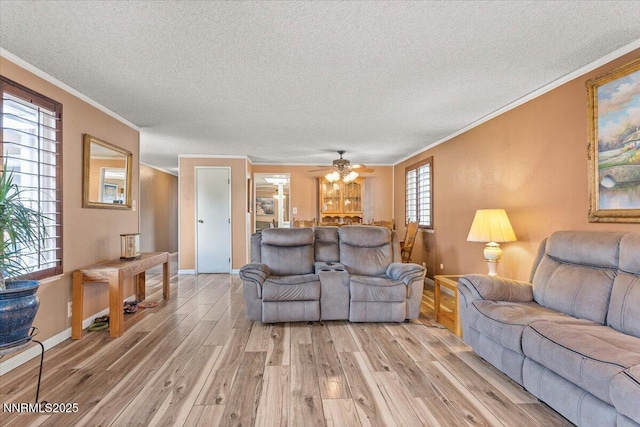 4415 Leche Way, Reno, NV 89502 - living area featuring light wood-type flooring, ornamental molding, a textured ceiling, baseboards, and ceiling fan