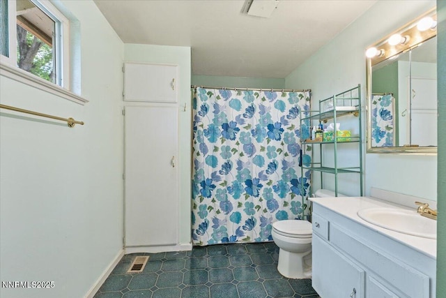 4415 Leche Way, Reno, NV 89502 - bathroom featuring toilet, vanity, and a shower with curtain