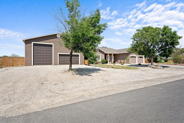 1055 Golden Park Way, Fallon, NV 89406 - view of front facade featuring stucco siding and gravel driveway