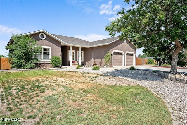 1055 Golden Park Way, Fallon, NV 89406 - ranch-style house featuring driveway, stucco siding, an attached garage, and french doors