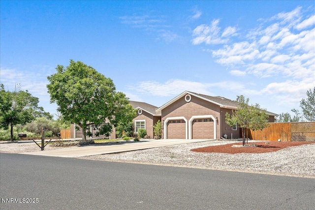 1055 Golden Park Way, Fallon, NV 89406 - view of front of home featuring an attached garage, driveway, and stucco siding