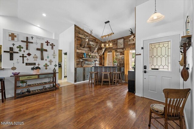 1055 Golden Park Way, Fallon, NV 89406 - entryway featuring wood finished floors, high vaulted ceiling, a dry bar, and baseboards