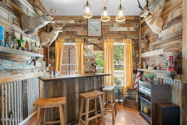 1055 Golden Park Way, Fallon, NV 89406 - indoor dry bar featuring wood finished floors and wood walls