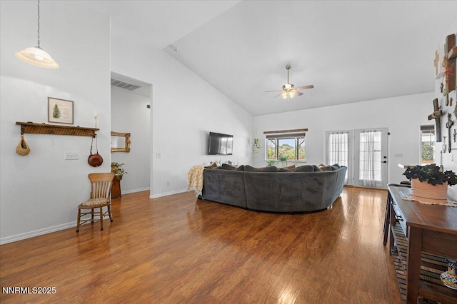 1055 Golden Park Way, Fallon, NV 89406 - living area with high vaulted ceiling, a ceiling fan, wood finished floors, and baseboards
