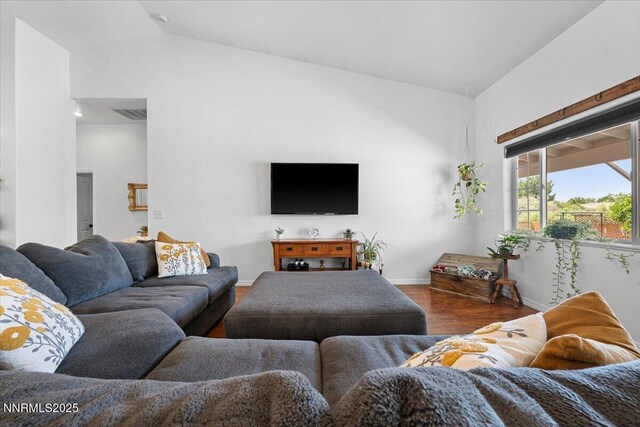 1055 Golden Park Way, Fallon, NV 89406 - living room with wood finished floors, baseboards, and lofted ceiling
