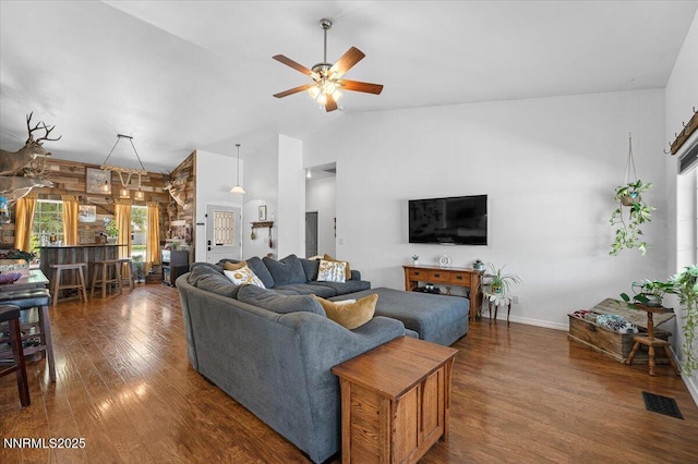 1055 Golden Park Way, Fallon, NV 89406 - living area with a ceiling fan, wood finished floors, high vaulted ceiling, and baseboards