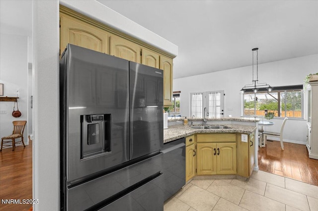1055 Golden Park Way, Fallon, NV 89406 - kitchen featuring refrigerator with ice dispenser, a sink, dishwasher, a peninsula, and light stone counters