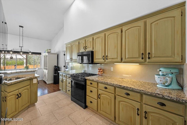 1055 Golden Park Way, Fallon, NV 89406 - kitchen featuring gas stove, stainless steel microwave, decorative backsplash, light stone counters, and pendant lighting