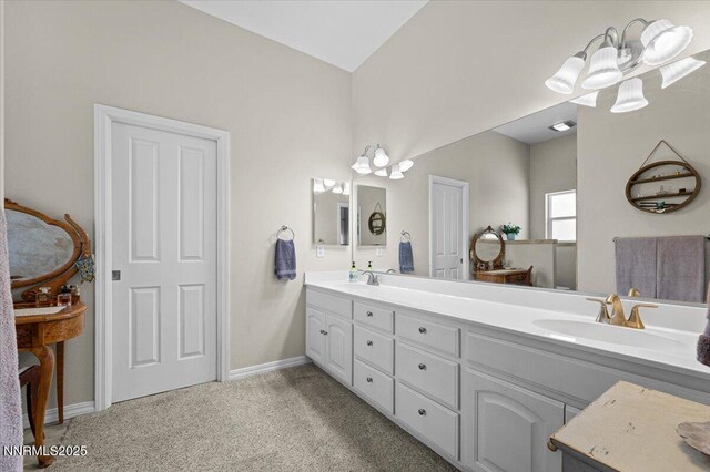 1055 Golden Park Way, Fallon, NV 89406 - bathroom with double vanity, baseboards, and carpet floors