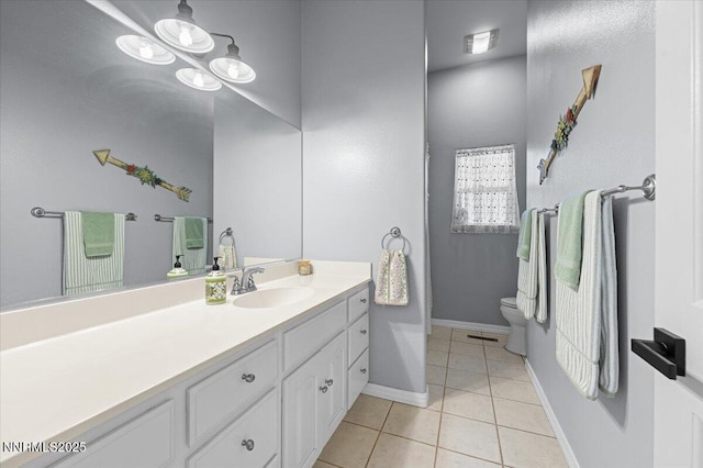 1055 Golden Park Way, Fallon, NV 89406 - bathroom with toilet, vanity, tile patterned floors, and baseboards