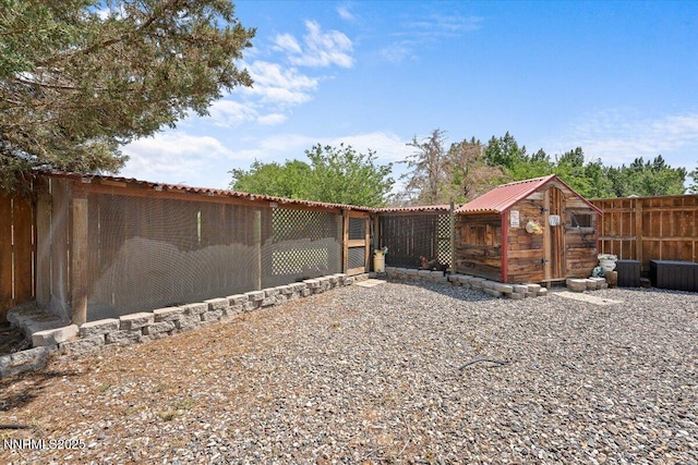 1055 Golden Park Way, Fallon, NV 89406 - fenced backyard featuring exterior structure and an outdoor structure