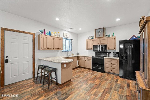 1055 Golden Park Way, Fallon, NV 89406 - kitchen featuring black appliances, a sink, light brown cabinetry, a peninsula, and dark wood-type flooring