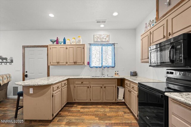1055 Golden Park Way, Fallon, NV 89406 - kitchen with black appliances, a sink, dark wood-style flooring, a breakfast bar area, and recessed lighting