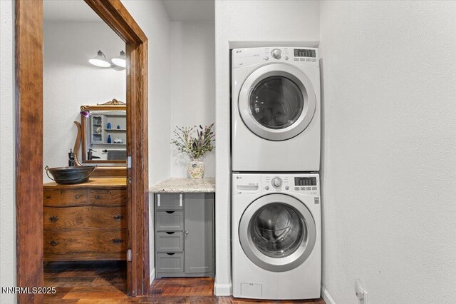 1055 Golden Park Way, Fallon, NV 89406 - laundry area featuring estacked washer and dryer and dark wood-style floors
