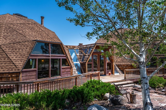 15118 N Timberline Dr, Reno, NV 89511 - back of house featuring a wooden deck and a shingled roof