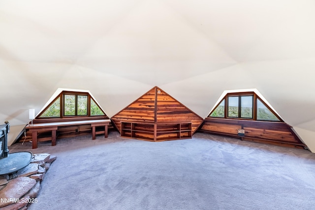 15118 N Timberline Dr, Reno, NV 89511 - bonus room with lofted ceiling, carpet floors, and a wood stove