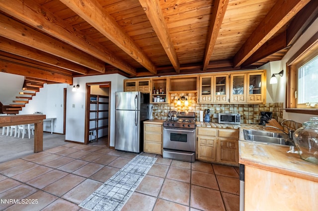 15118 N Timberline Dr, Reno, NV 89511 - kitchen featuring appliances with stainless steel finishes, backsplash, a sink, tile countertops, and open shelves
