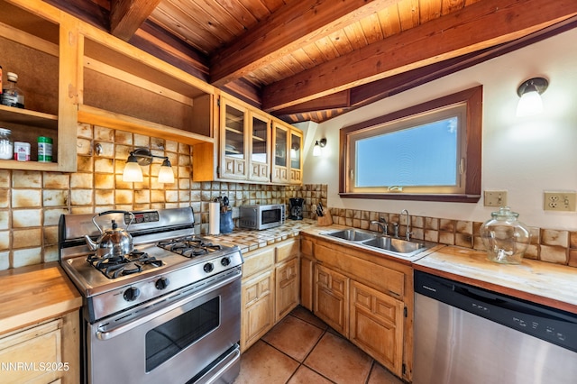 15118 N Timberline Dr, Reno, NV 89511 - kitchen with stainless steel appliances, a sink, wooden ceiling with exposed beams, decorative backsplash, and light tile patterned floors
