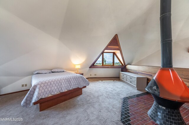 15118 N Timberline Dr, Reno, NV 89511 - carpeted bedroom with a wood stove and vaulted ceiling
