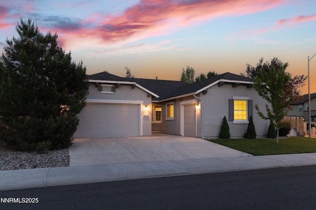 1509 Lasso Ln, Gardnerville, NV 89410 - single story home with a garage, stucco siding, concrete driveway, and a yard