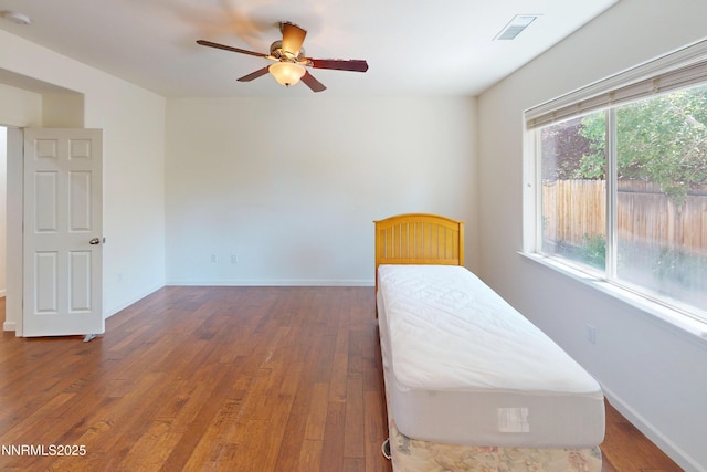 1509 Lasso Ln, Gardnerville, NV 89410 - unfurnished bedroom with wood finished floors, baseboards, and a ceiling fan