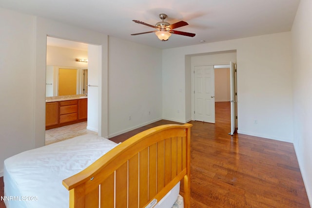 1509 Lasso Ln, Gardnerville, NV 89410 - bedroom with light wood-style flooring, ensuite bath, baseboards, and a ceiling fan