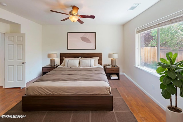 1509 Lasso Ln, Gardnerville, NV 89410 - bedroom with wood finished floors, baseboards, and a ceiling fan