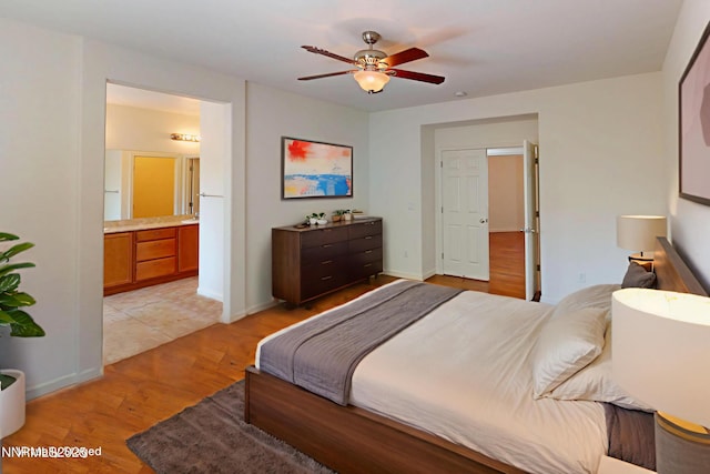 1509 Lasso Ln, Gardnerville, NV 89410 - bedroom featuring light wood-type flooring, ensuite bath, a ceiling fan, and baseboards