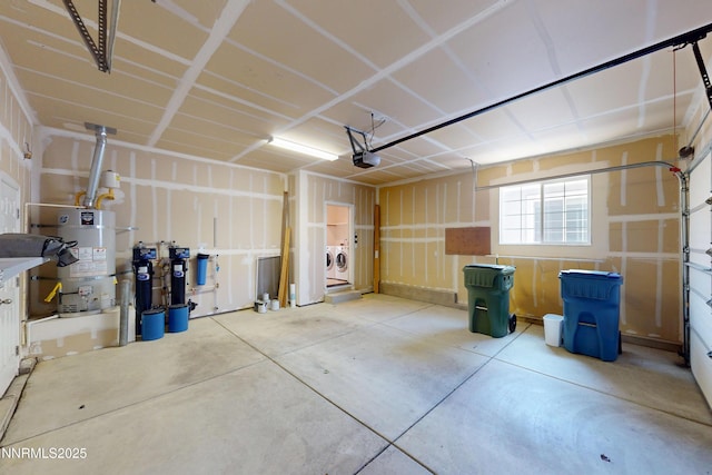 1509 Lasso Ln, Gardnerville, NV 89410 - garage with strapped water heater, washing machine and clothes dryer, and a garage door opener