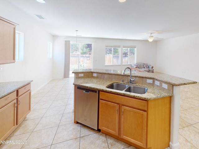 1509 Lasso Ln, Gardnerville, NV 89410 - kitchen featuring dishwasher, a sink, light tile patterned floors, light stone countertops, and an island with sink