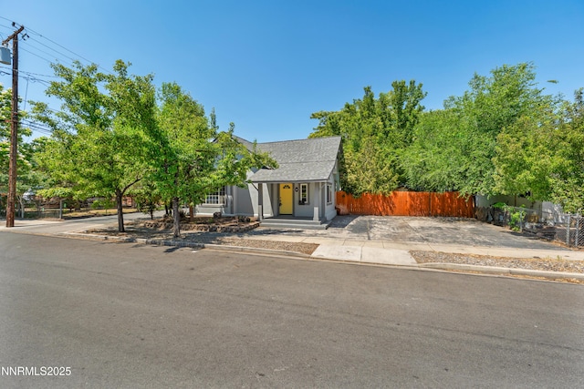 621 9th St, Sparks, NV 89431 - view of property hidden behind natural elements featuring a shingled roof