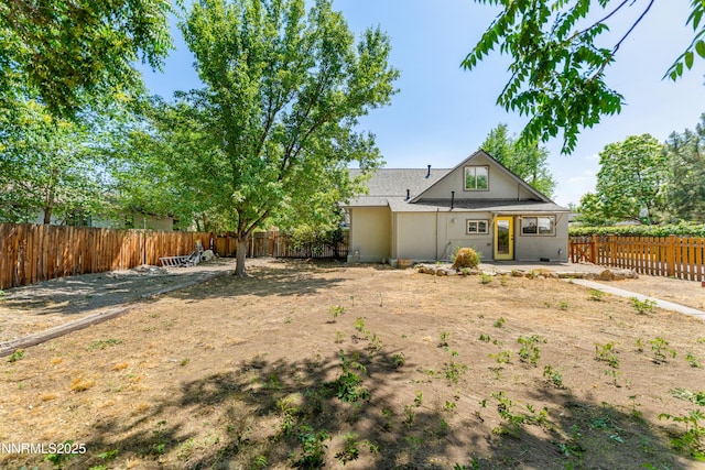 621 9th St, Sparks, NV 89431 - back of property featuring a fenced backyard and a patio