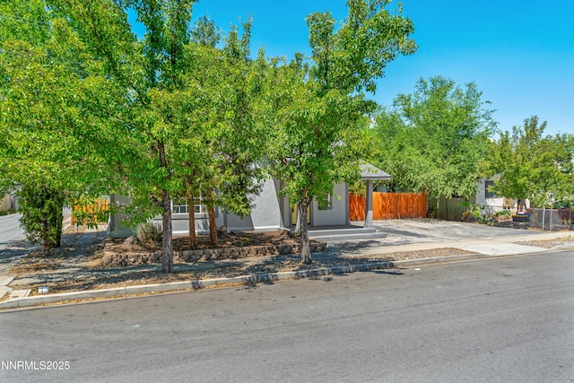 621 9th St, Sparks, NV 89431 - view of property hidden behind natural elements featuring stucco siding