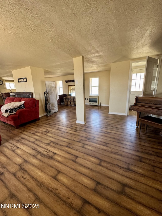 13995 Grass Valley Rd, Winnemucca, NV 89445 - living area with a textured ceiling, hardwood / wood-style flooring, and baseboards