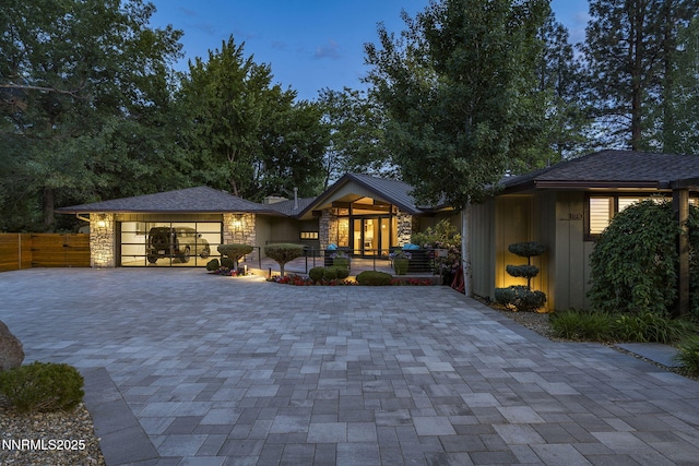 1180 Manzanita Ln, Reno, NV 89509 - view of front of property with a garage, decorative driveway, and stone siding