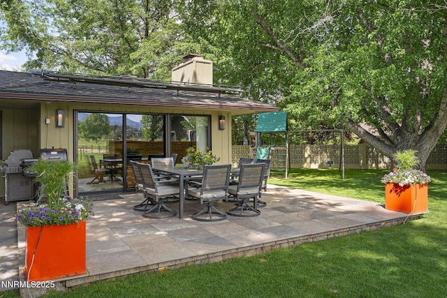 1180 Manzanita Ln, Reno, NV 89509 - view of patio featuring outdoor dining area, area for grilling, and a playground