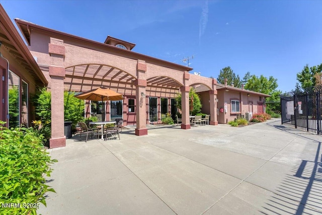 6850 Sharlands Ave Unit F2030, Reno, NV 89523 - view of community with outdoor dining area, a patio, and a pergola