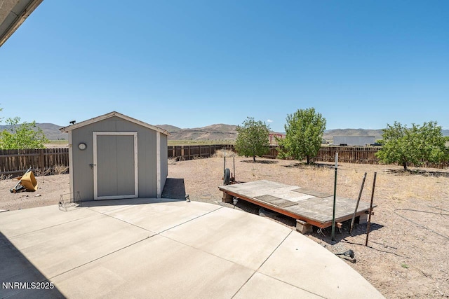 4945 Broken Spur Rd, Reno, NV 89510 - fenced backyard featuring a mountain view and a patio