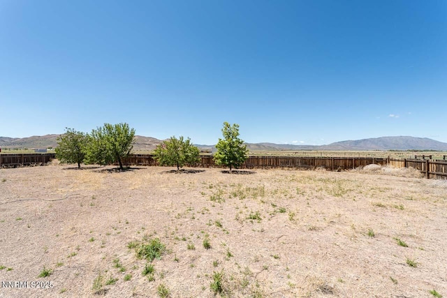 4945 Broken Spur Rd, Reno, NV 89510 - fenced backyard featuring a mountain view