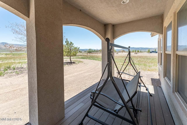 4945 Broken Spur Rd, Reno, NV 89510 - wooden deck with a mountain view and a rural view