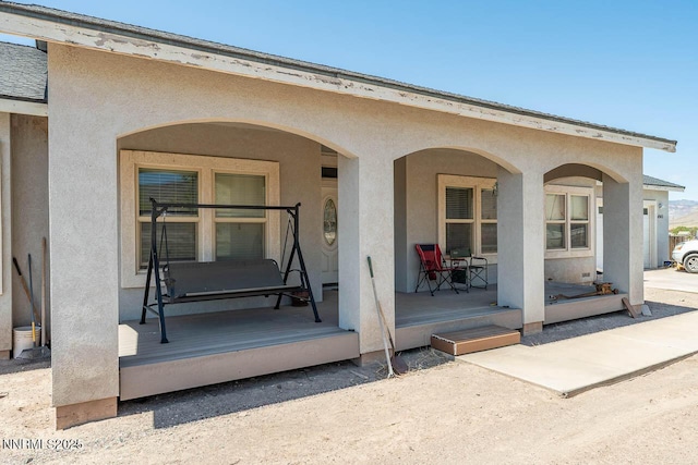 4945 Broken Spur Rd, Reno, NV 89510 - property entrance featuring stucco siding and covered porch