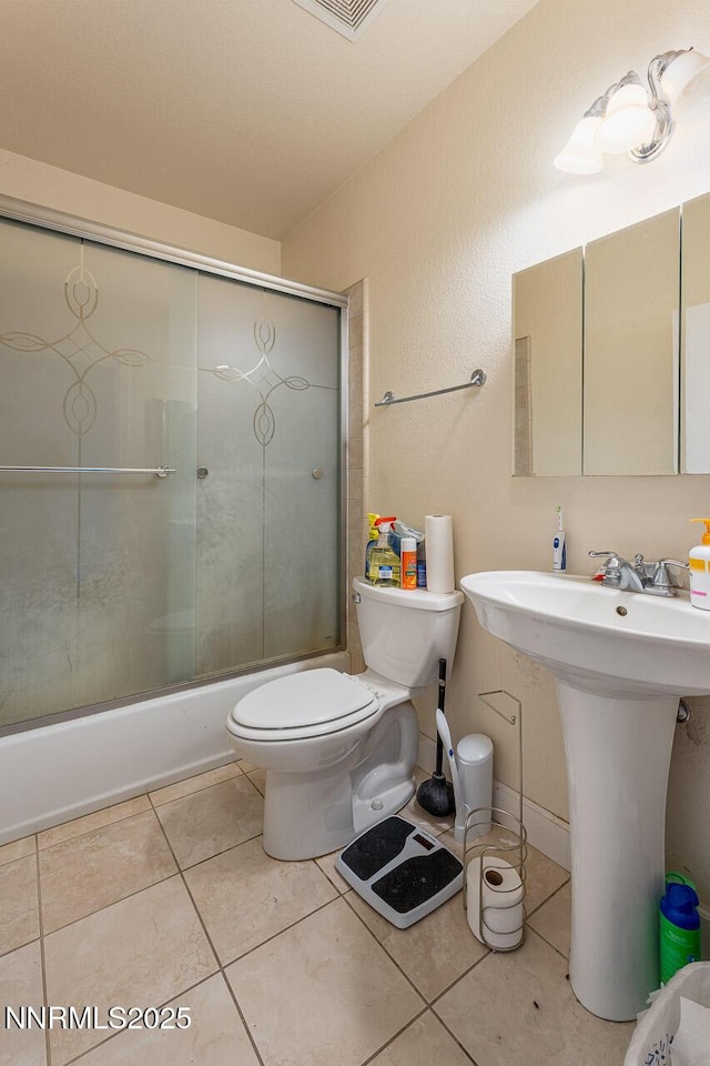 4945 Broken Spur Rd, Reno, NV 89510 - full bath featuring toilet, enclosed tub / shower combo, and tile patterned floors