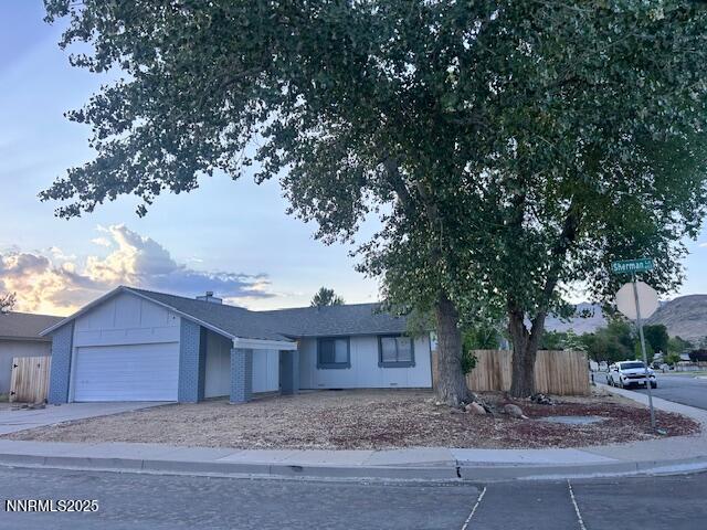 2510 Panamint Rd, Carson City, NV 89706 - ranch-style home with a garage, concrete driveway, and board and batten siding