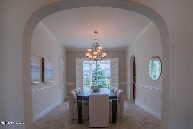 8270 Antler Pointe Ct, Reno, NV 89523 - dining room featuring ornamental molding, a chandelier, arched walkways, and healthy amount of natural light